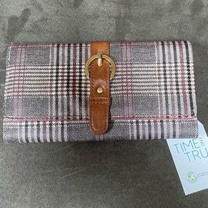 Brand new plaid wallet black, tan and maroon in color with gold buckle